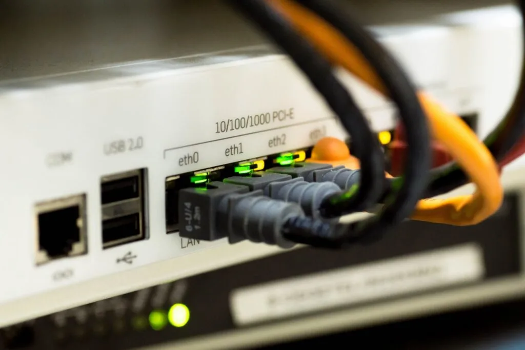 Technician holding fiber optic cable for testing and certification