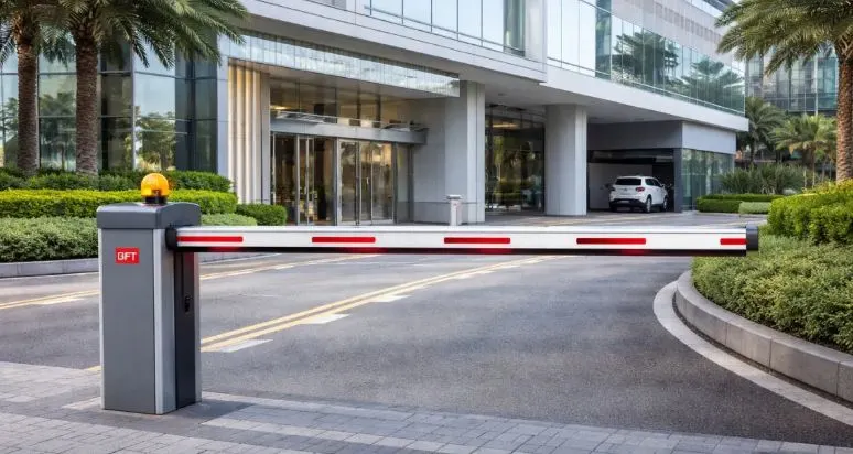 Automatic gate barrier Dubai installation at the entrance of a modern glass office building