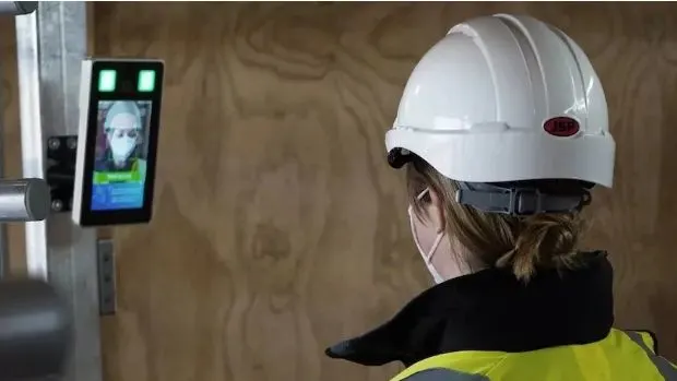 Staff using access control system in a retail store